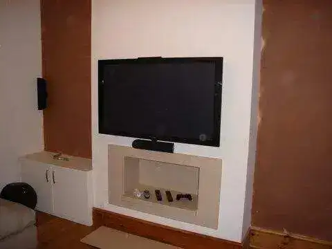 Tilting bracket installation at optimal viewing height in a living room