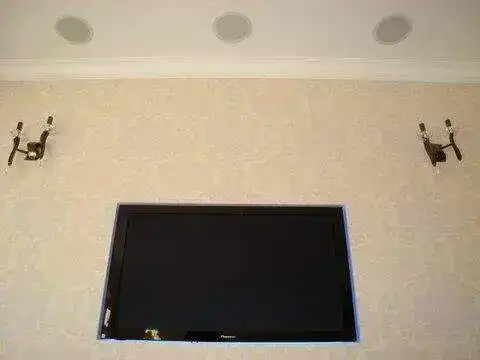 TV mounted on feature wall with cables dropped behind plasterboard