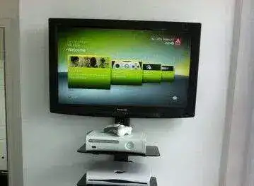 Samsung QLED mounted on partition wall with cables routed to AV cabinet