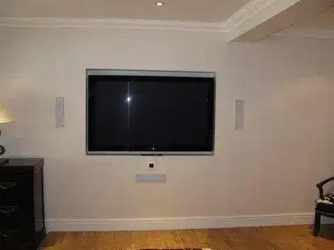 Bedroom TV fitted on plasterboard with spring toggle fixings