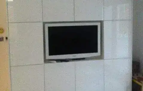 Sony Bravia 55" flush-mounted on freshly plastered chimney breast