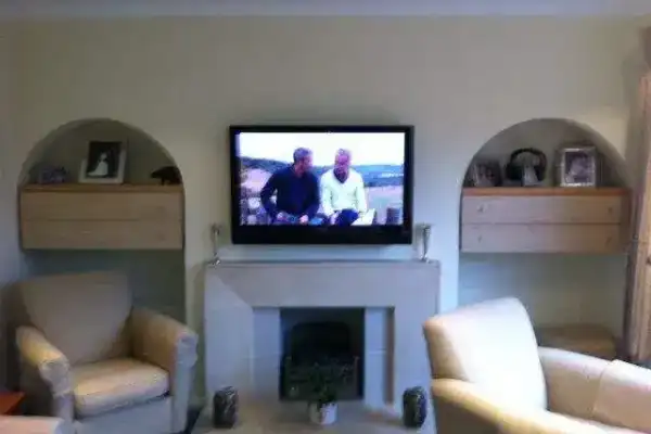 Screen fitted on stud wall with metal frame — specialist fixings used