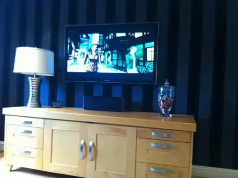 Home entertainment system installation with concealed cabling