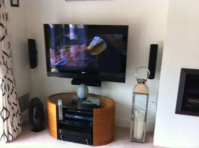 Mounted display above a fireplace — example 26